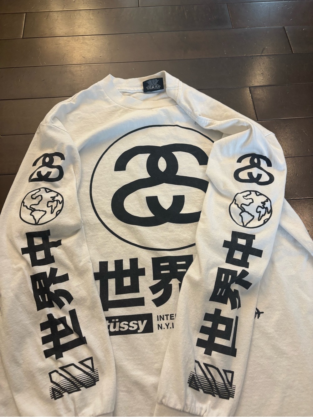 Stussy White Long Sleeve Graphic Tee with Black Print